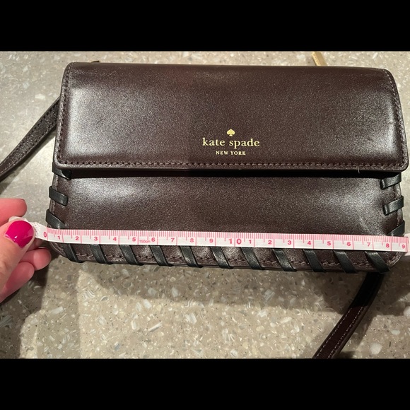 Rich chocolate brown mini bag has an adjustable shoulder strap and gold letters - Picture 9 of 12